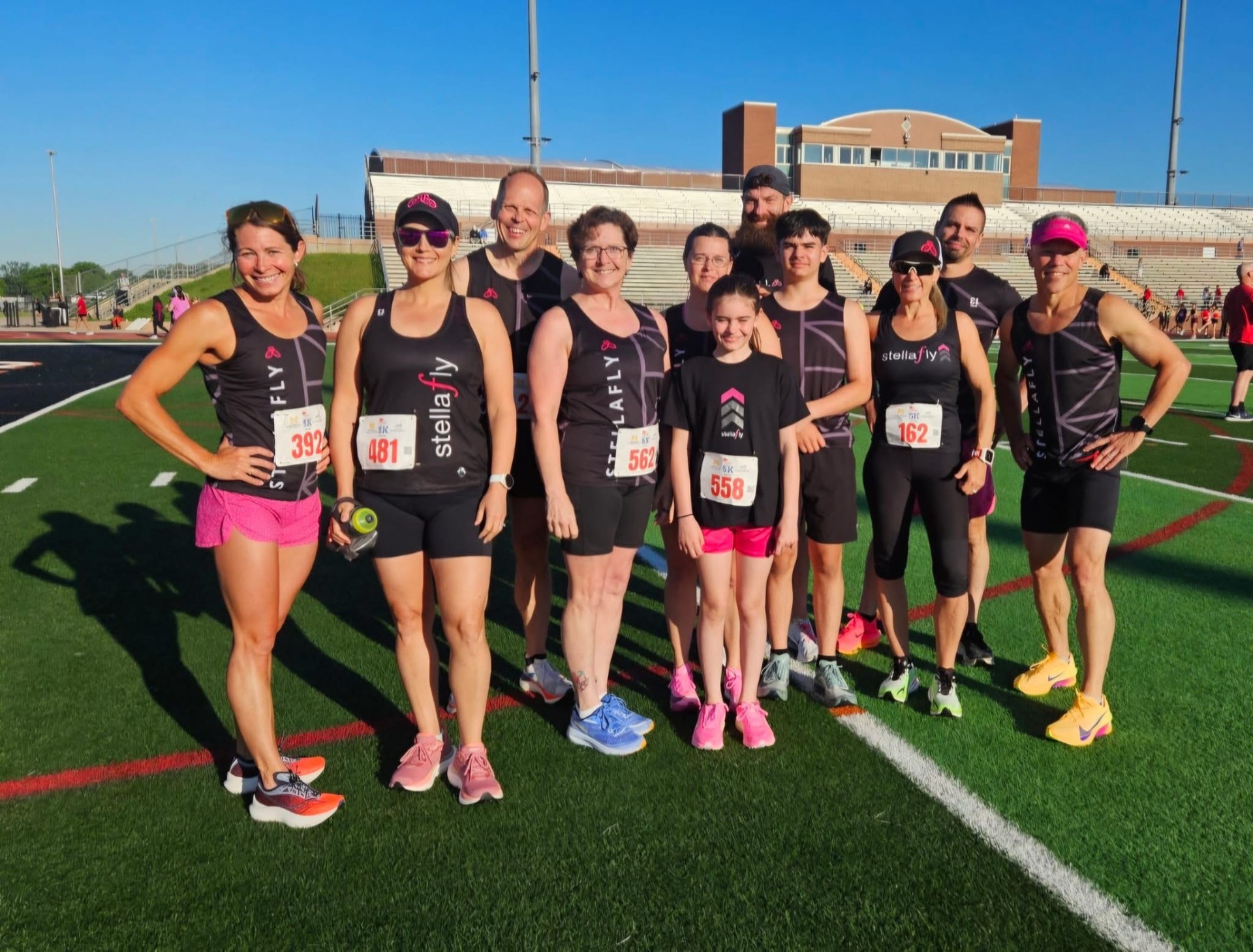 StellaFly runners together after a race on the field